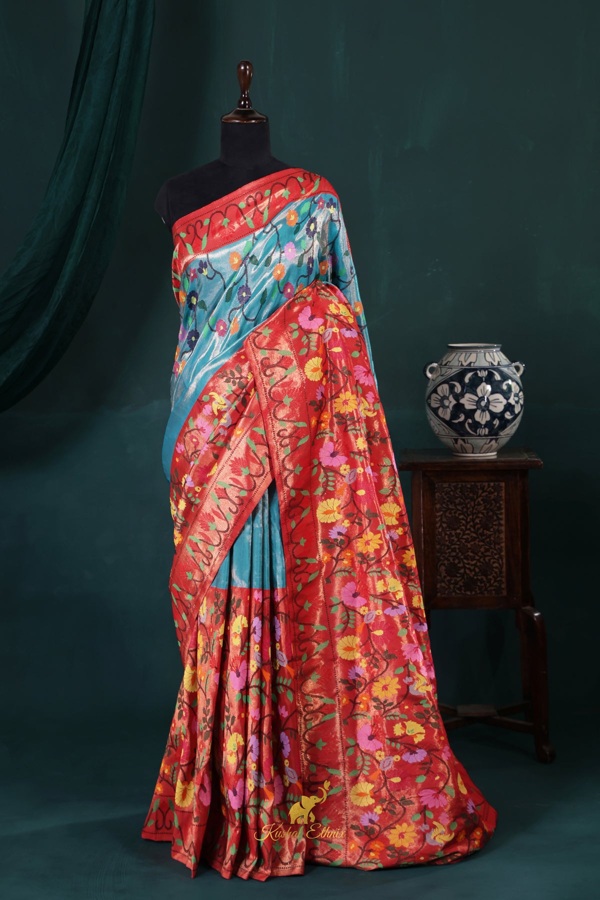4-Ply Zari Kota Saree – Coral Red & Sky Blue Floral Elegance